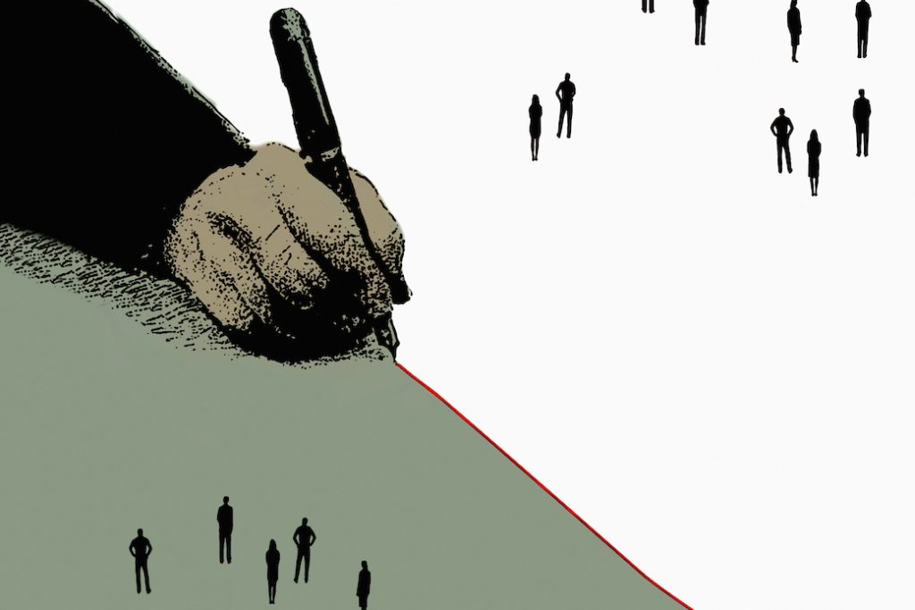 Hand drawing red dividing line separating groups of people