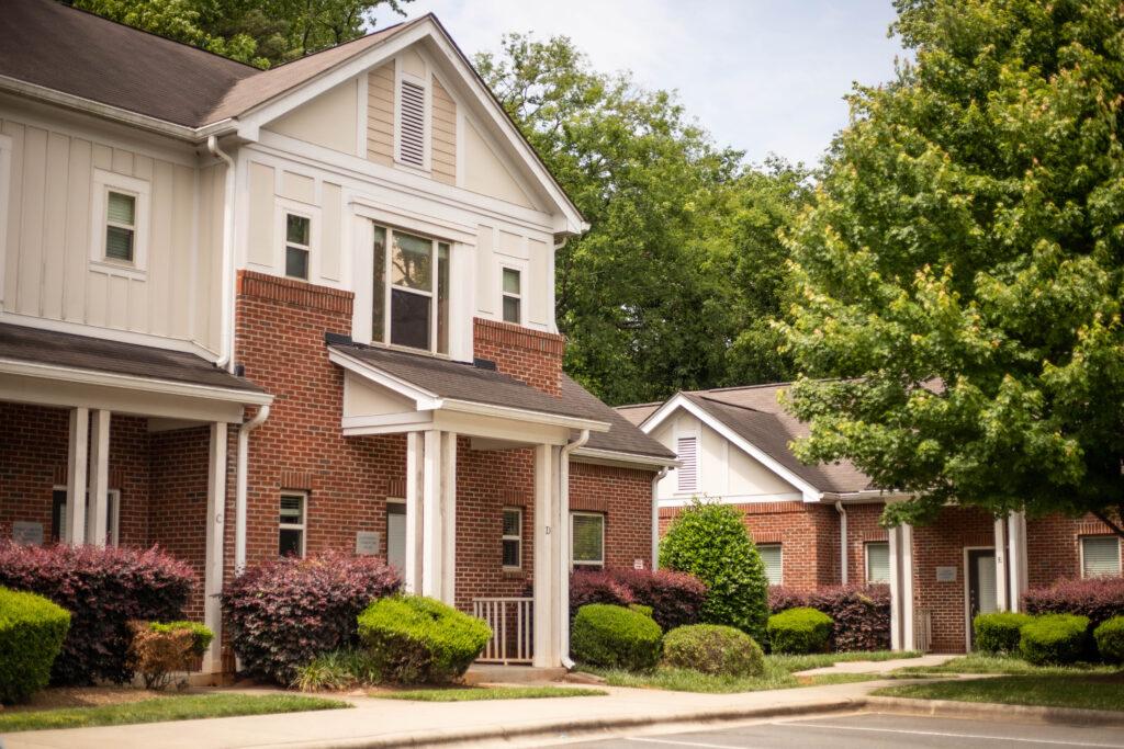 Image of YWCA's transitional housing program, Families Together, townhouses, surrounded by trees.